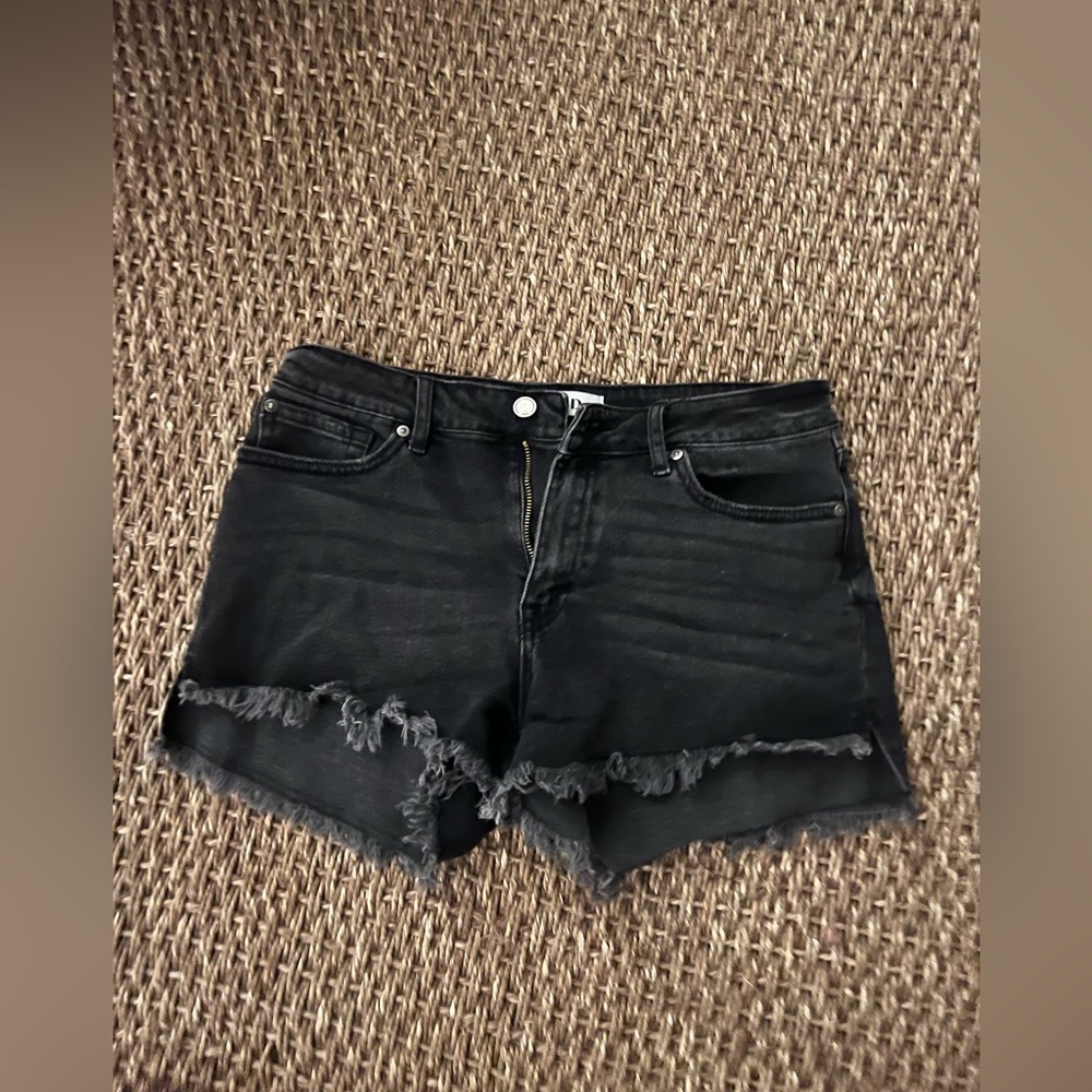 JBD, black jean shorts.